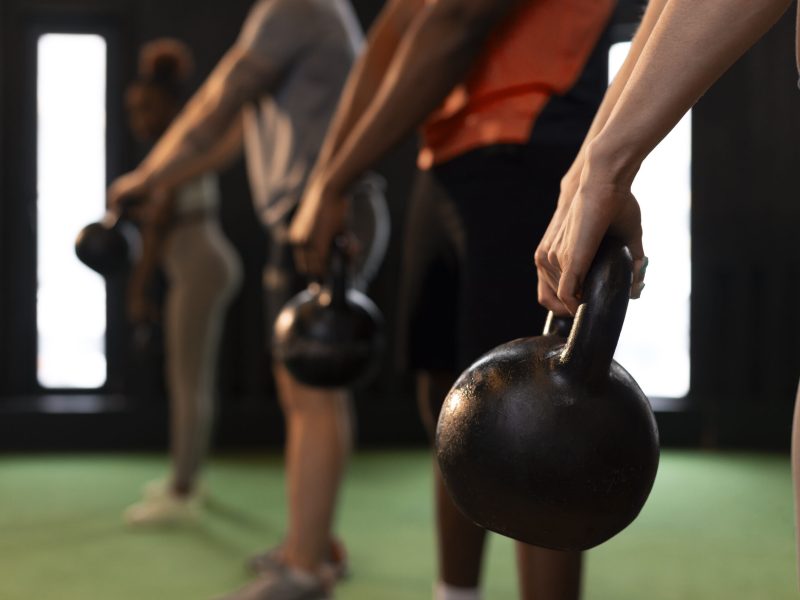 side-view-people-training-together-gym
