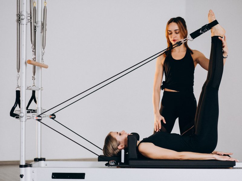 Women doing pilates on a reformer